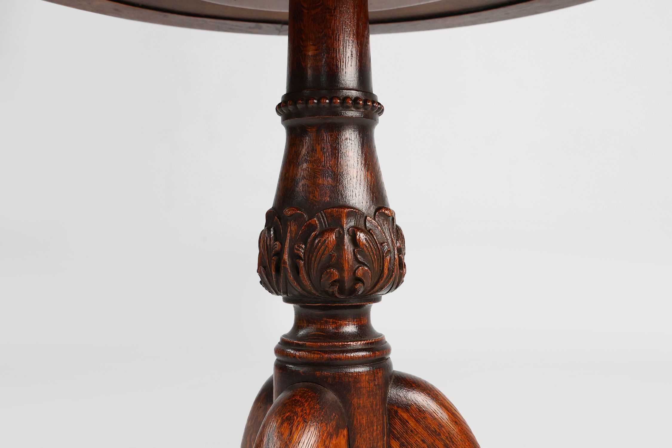 Antique English hand carved circular oak side table with lions head feet thumbnail